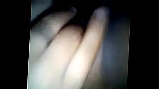 a girl is fucking her self with her hand
