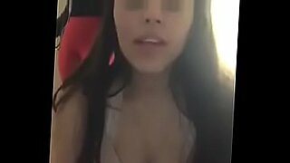 brunette with fake tits strips and sucks pov